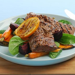 Orange mustard barbecued steaks